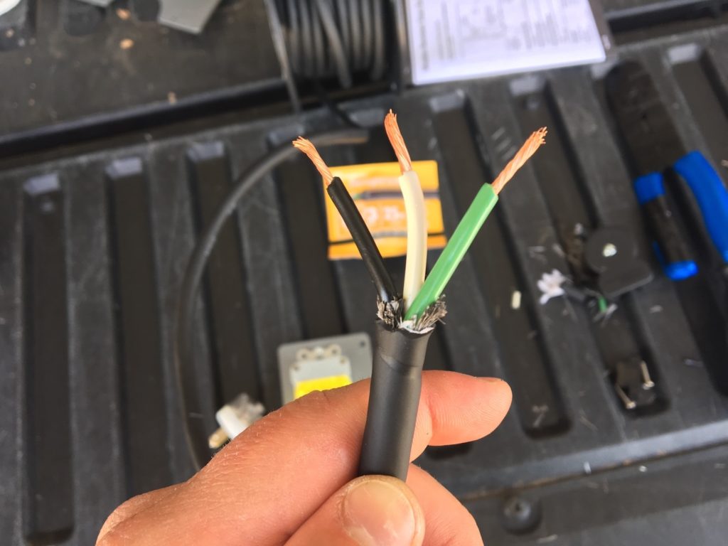 Positive, neutral, and ground wires ready to be connected.