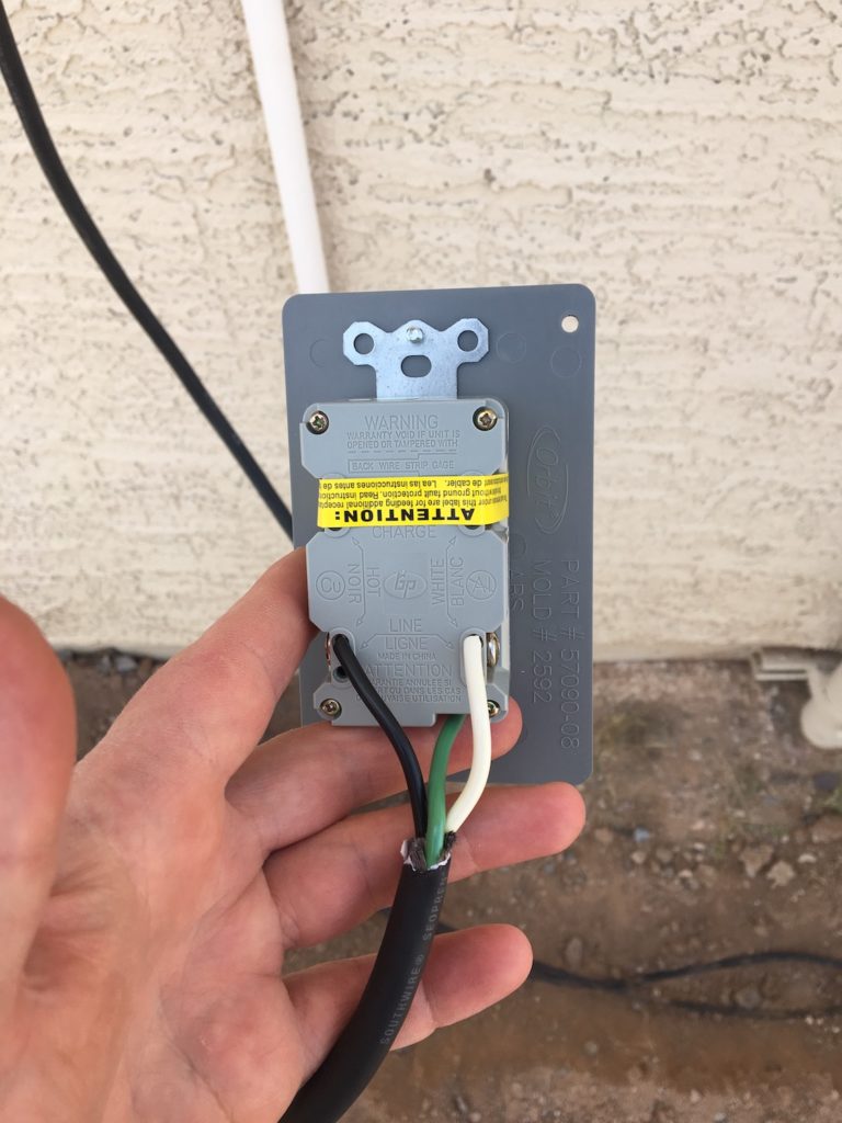 Wires connected to the plug that goes inside the DIY weather station housing.