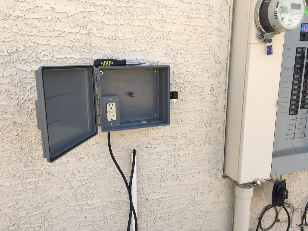 GFCI Outlet for the DIY weather station mounted in the sprinkler box with power cord connected
