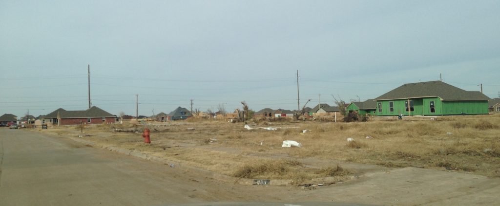 New houses rise up in the tornado-ravaged Plaza Towers neighborhood of Moore, Oklahoma in November, 2013