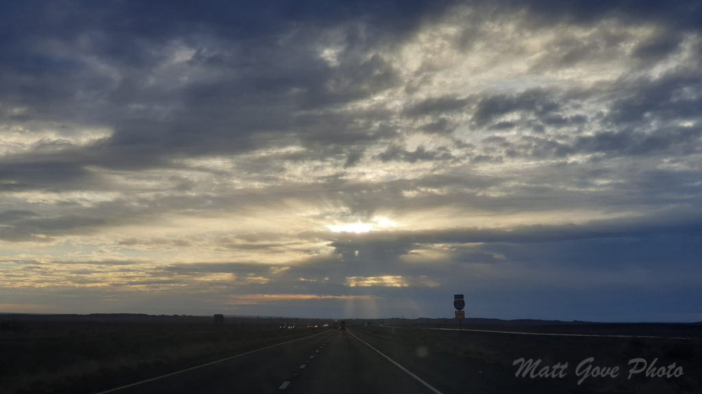 Morning sun shines through the clouds on Interstate 40 in Arizona during the COVID-19 pandemic