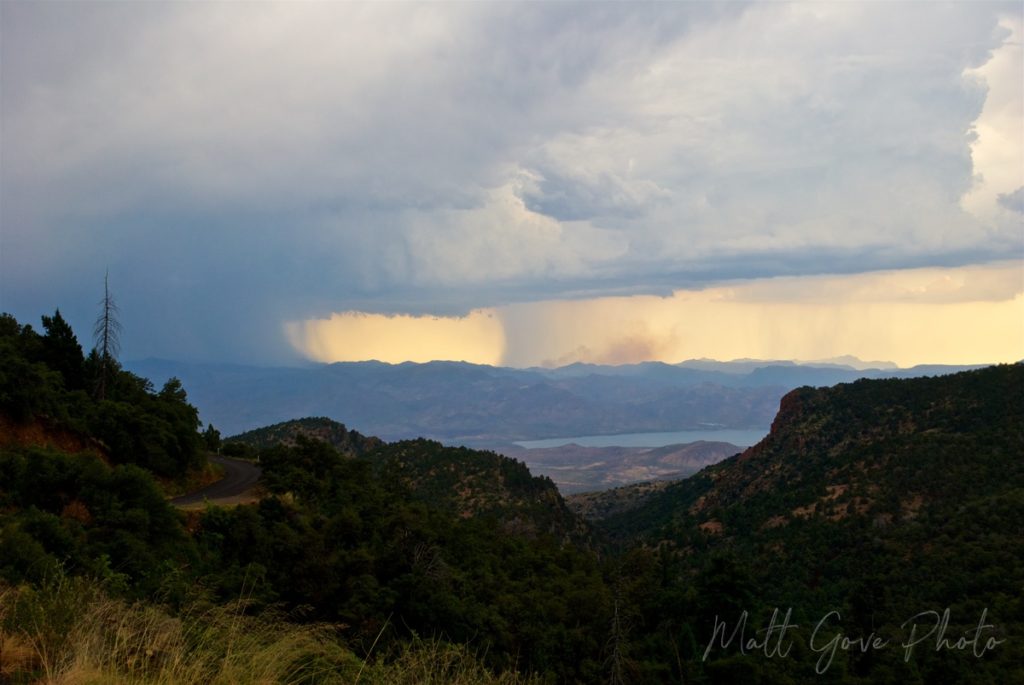 Monsoon showers provide a dramatic sky over the rugged landscape of the Superstition Mountains in Arizona.